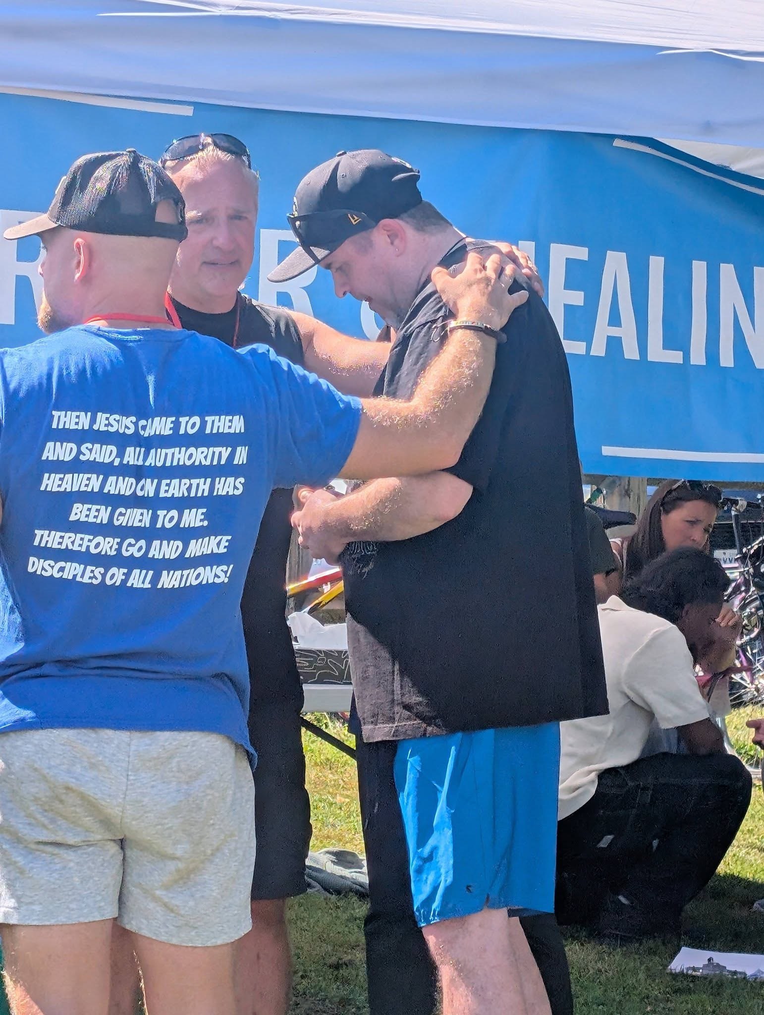 Prayer at the Prayer and Healing tent